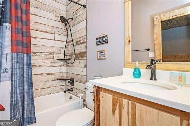 full bathroom featuring toilet, shower / tub combo, and vanity