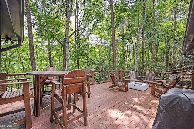 wooden deck with area for grilling