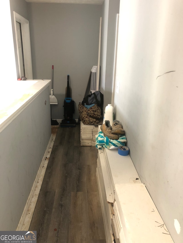 hallway with dark wood-type flooring