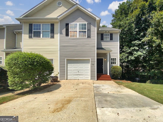 view of front facade featuring driveway and an attached garage