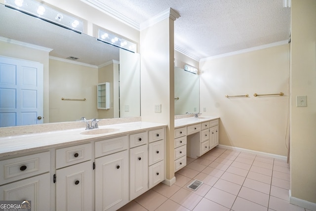 bathroom featuring ornamental molding, tile patterned flooring, a textured ceiling, and vanity