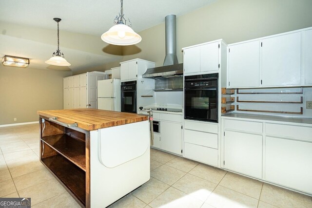 kitchen with pendant lighting, white refrigerator, white cabinets, and oven