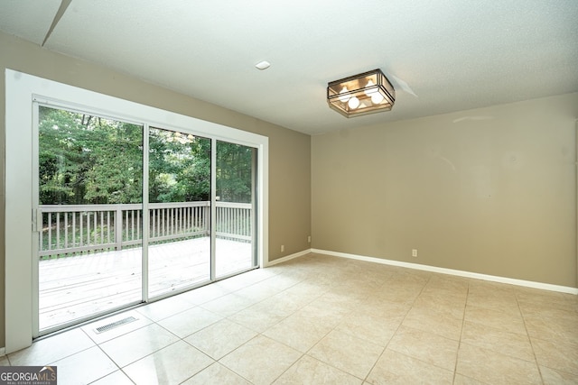 view of tiled spare room