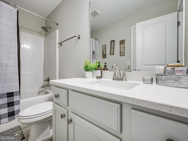 full bathroom featuring shower / bathtub combination with curtain, visible vents, vanity, and toilet