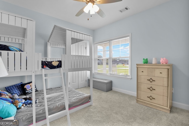 bedroom with ceiling fan and light colored carpet