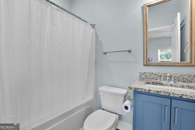 full bathroom with toilet, shower / bathtub combination with curtain, and vanity