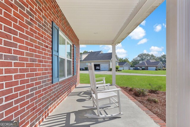 view of patio / terrace featuring a garage