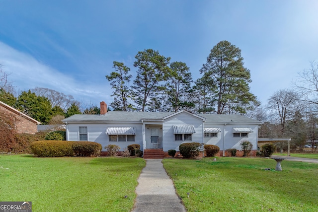 ranch-style home with a front lawn