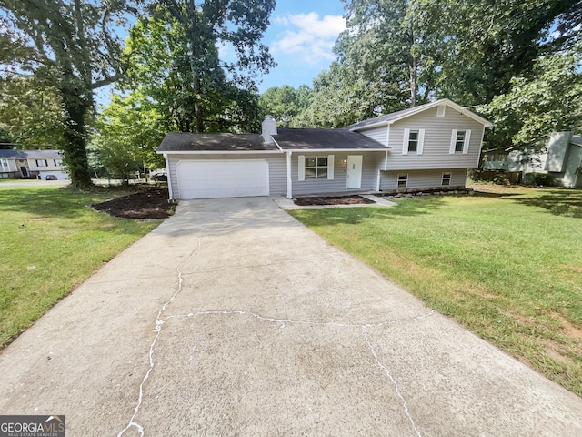 split level home featuring a garage and a front yard