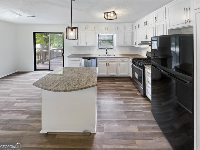 kitchen featuring dark hardwood / wood-style flooring, white cabinetry, sink, and appliances with stainless steel finishes