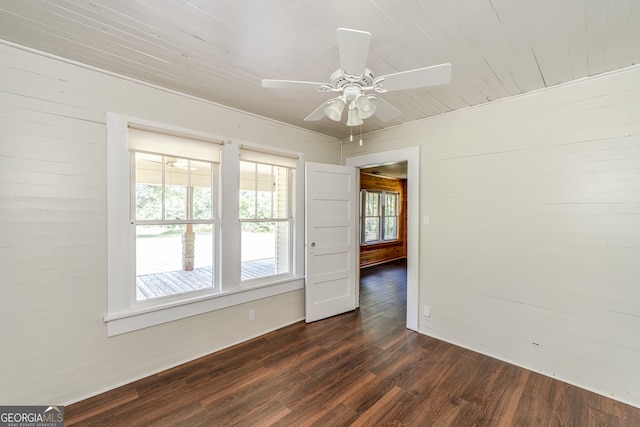 empty room with hardwood / wood-style floors and ceiling fan