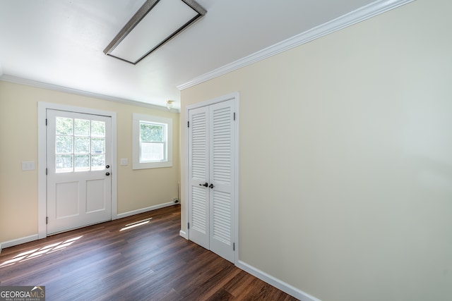 entrance foyer with crown molding and dark hardwood / wood-style flooring