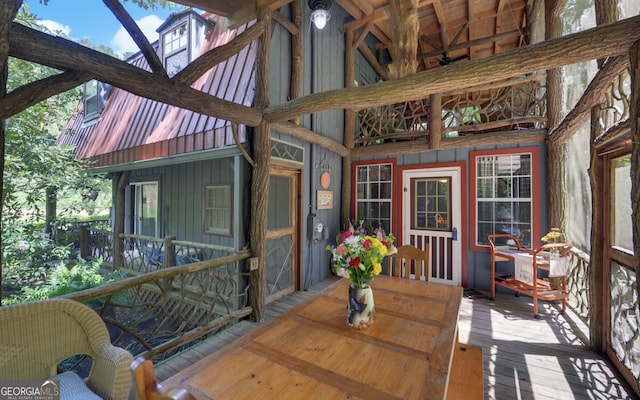 sunroom with lofted ceiling and plenty of natural light