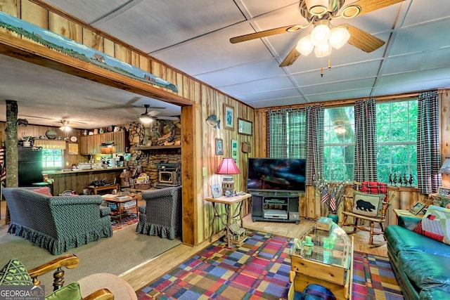 605 W Wildcat Rd, Clarkesville, GA 30523 - living area with ceiling fan, wood walls, and wood finished floors