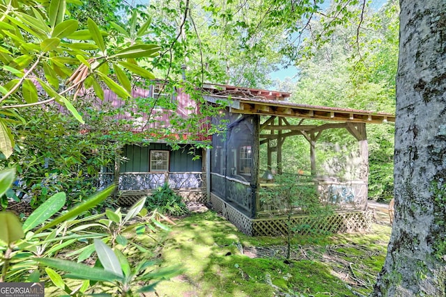 605 W Wildcat Rd, Clarkesville, GA 30523 - back of property with a sunroom and board and batten siding