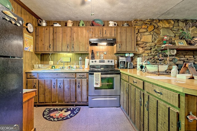 605 W Wildcat Rd, Clarkesville, GA 30523 - kitchen with freestanding refrigerator, electric stove, a sink, under cabinet range hood, and light countertops
