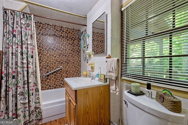 605 W Wildcat Rd, Clarkesville, GA 30523 - full bathroom with vanity, shower / bath combination with curtain, toilet, and tile walls