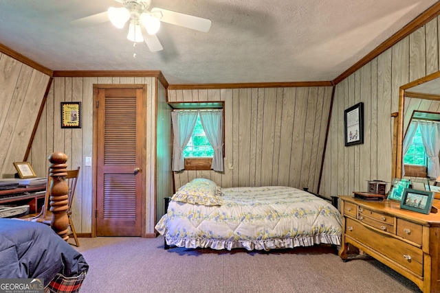 605 W Wildcat Rd, Clarkesville, GA 30523 - carpeted bedroom with ornamental molding, wood walls, and a ceiling fan