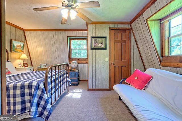 605 W Wildcat Rd, Clarkesville, GA 30523 - bedroom with crown molding, wood walls, carpet floors, baseboards, and a ceiling fan