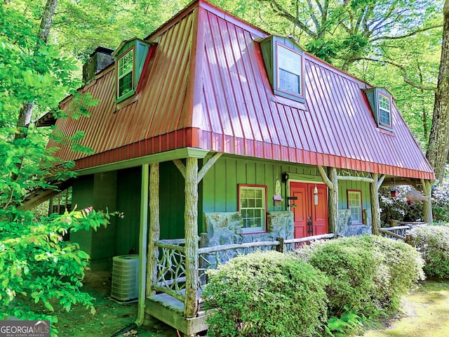 605 W Wildcat Rd, Clarkesville, GA 30523 - view of front of house featuring metal roof, central AC unit, covered porch, a chimney, and a gambrel roof
