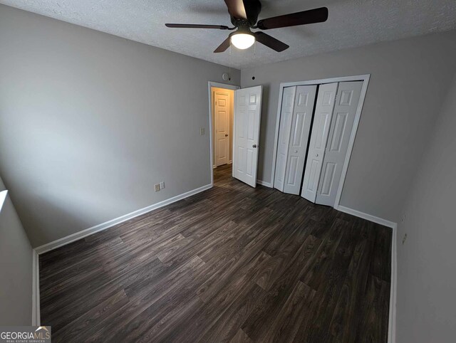 unfurnished bedroom featuring a textured ceiling, a closet, ceiling fan, and hardwood / wood-style flooring