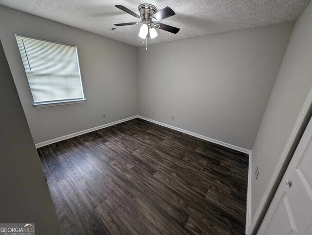 unfurnished room with ceiling fan, a textured ceiling, and hardwood / wood-style floors