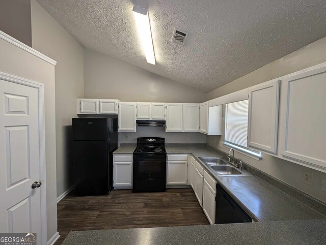 kitchen featuring white cabinetry, sink, black appliances, lofted ceiling, and dark wood-type flooring