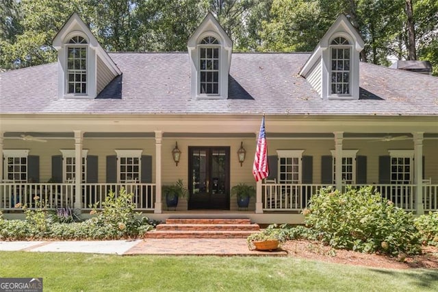 new england style home featuring a porch