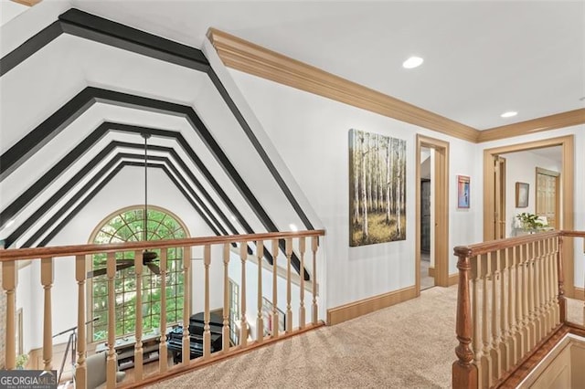 hallway featuring vaulted ceiling and carpet