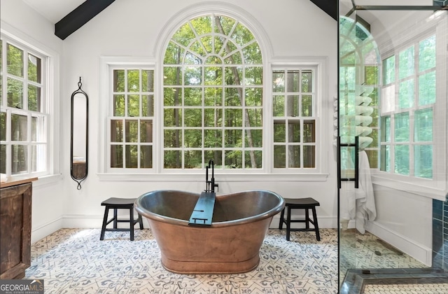 sunroom / solarium featuring vaulted ceiling