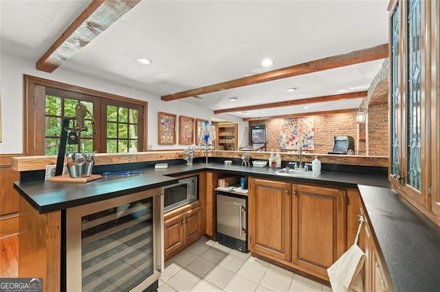 bar with beamed ceiling, stainless steel appliances, wine cooler, and sink