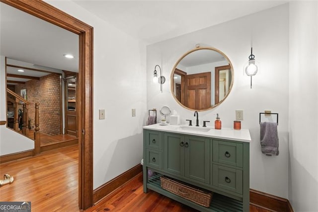 bathroom featuring vanity and hardwood / wood-style floors