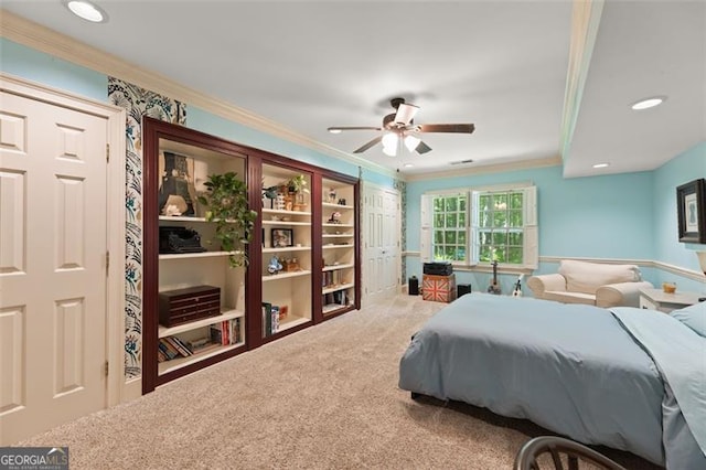 bedroom featuring crown molding, carpet flooring, and ceiling fan