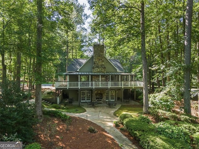 back of house with a patio area and french doors