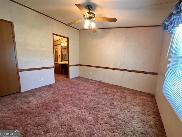 empty room with ceiling fan and carpet floors