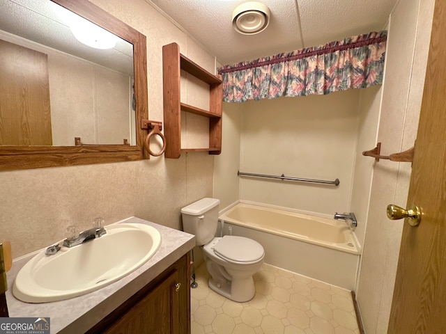 full bathroom featuring vanity, tile patterned floors, a textured ceiling, toilet, and washtub / shower combination