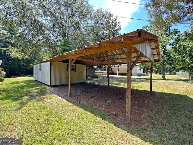 view of vehicle parking with a yard and a carport