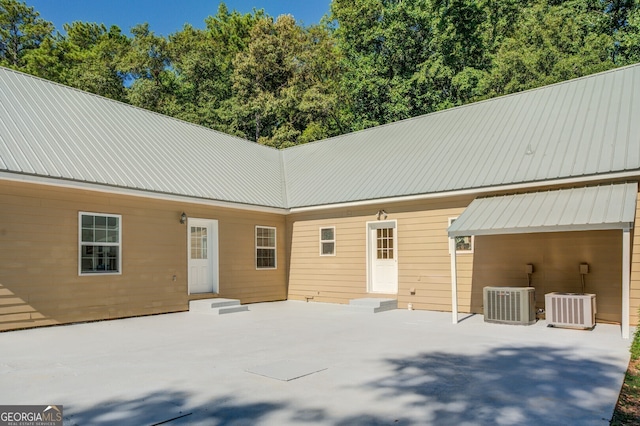 exterior space with central AC and a patio area