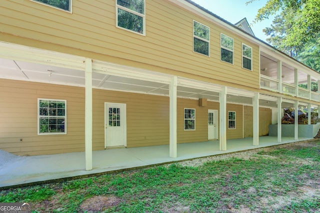 back of house with a patio