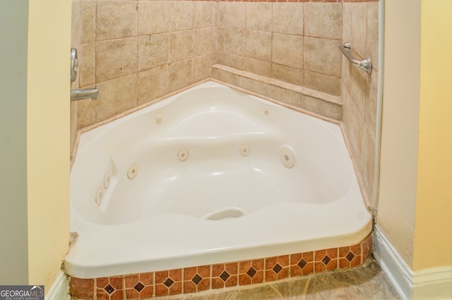 bathroom with tile patterned flooring and a bathing tub