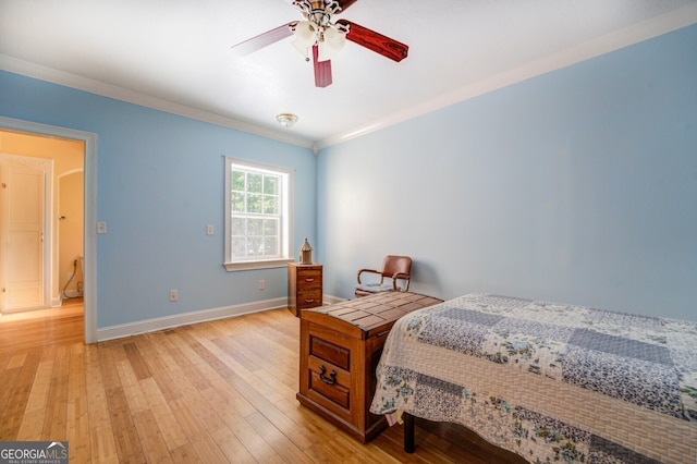 bedroom with light wood-type flooring, ornamental molding, and ceiling fan