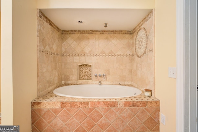 bathroom featuring tiled bath