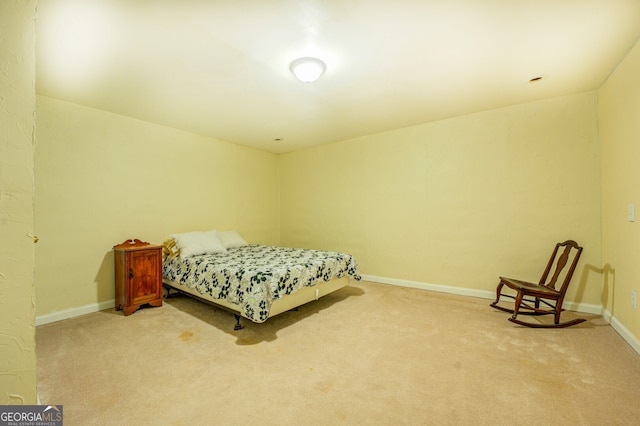 bedroom featuring light colored carpet