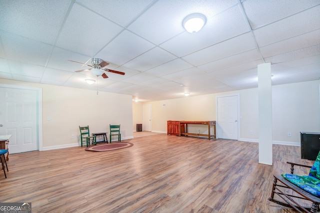 sitting room featuring light hardwood / wood-style floors, a paneled ceiling, and ceiling fan