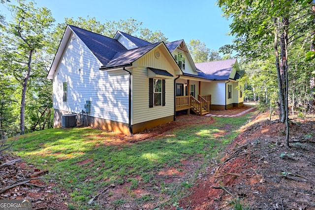 rear view of house with central air condition unit