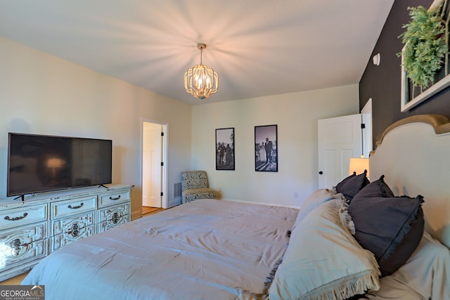 bedroom featuring an inviting chandelier