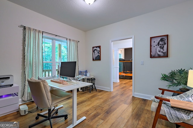 office area featuring hardwood / wood-style floors