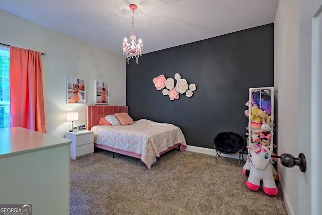 carpeted bedroom featuring an inviting chandelier