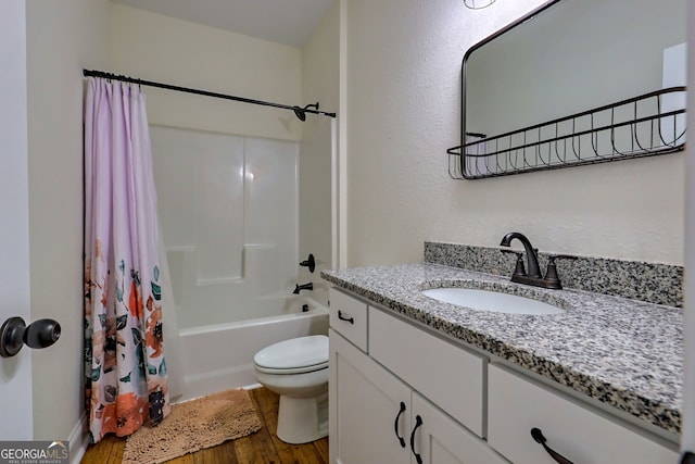 full bathroom featuring wood-type flooring, vanity, toilet, and shower / bath combo with shower curtain