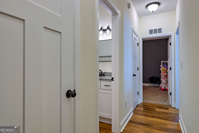 hall featuring dark wood-type flooring